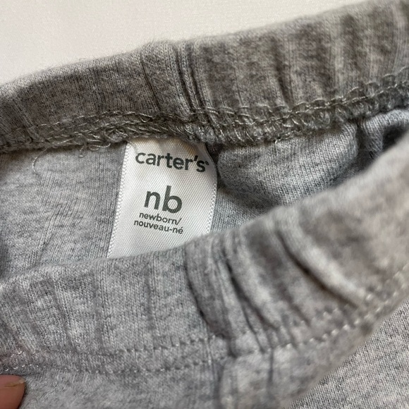 Girls Carter’s size newborn 3 pants, 2 sleep sacks, 1 shirt, and 1 onsie set. - Picture 9 of 11